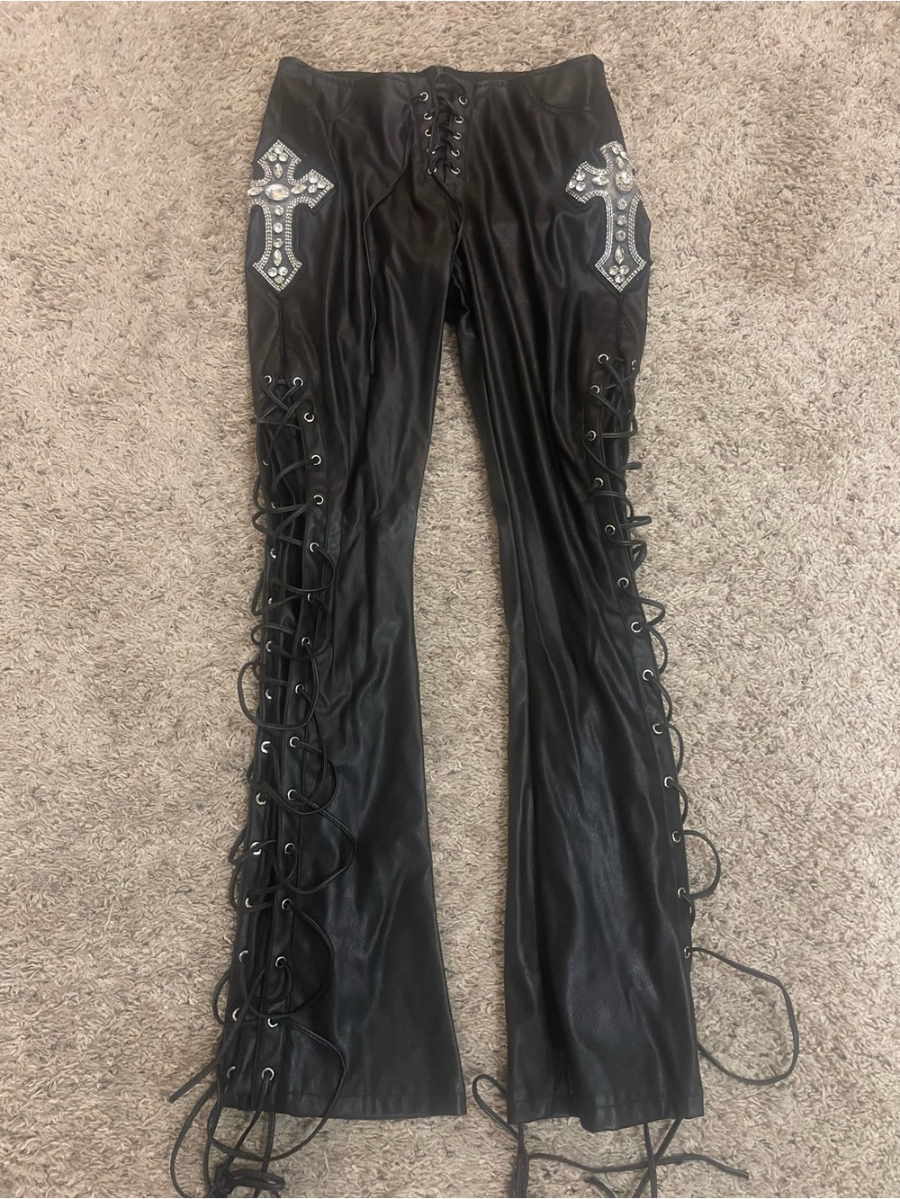 Current mood Black faux leather low rise pants with rhinestone crosses. Size m
